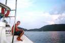 Traig on the stern of the ScubaCat at Saba Rock, North Sound