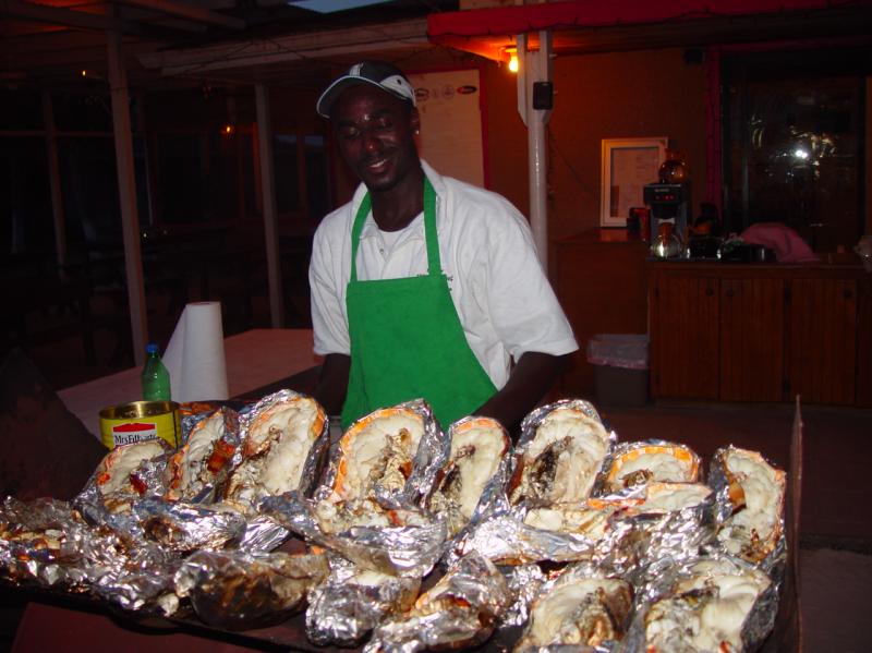 Dinner almost ready - Anagada Reef Hotel - Look at the size of those lobsters!

(Click on image to view full-size image (1280x960, 551 kb))